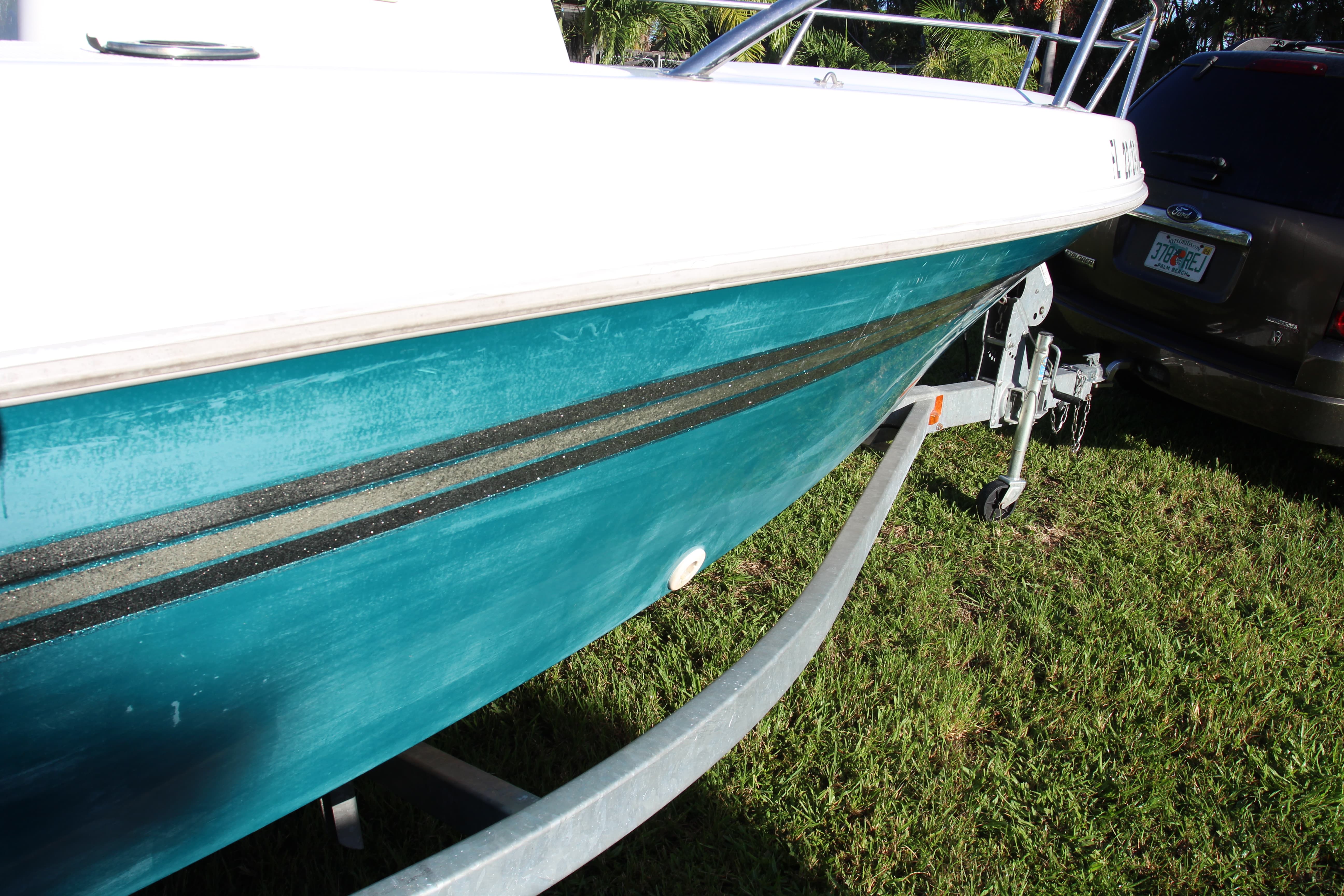 Highly oxidized and faded green color on Ranger boat