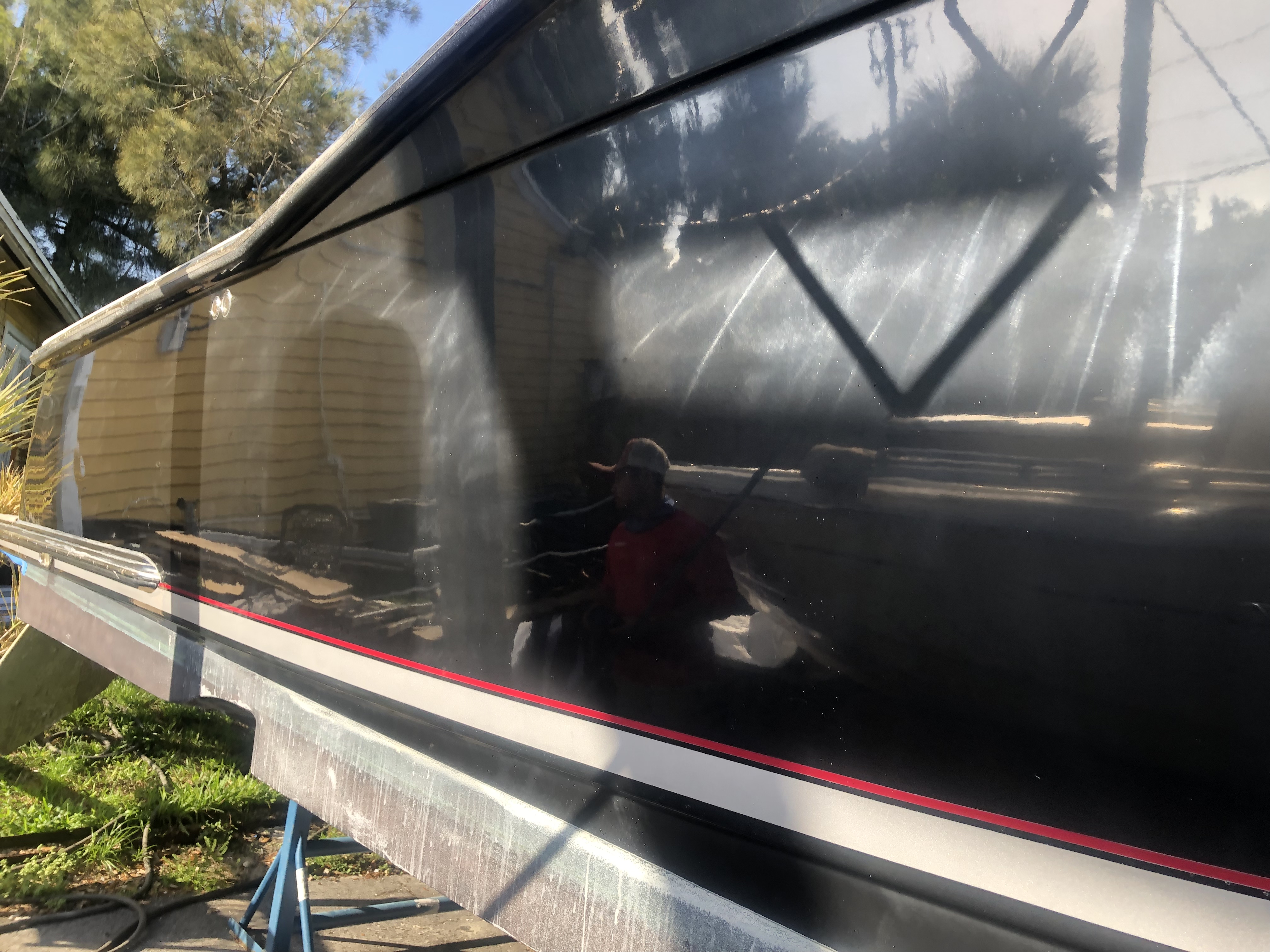 Oxidization on the black hull 35 Scout before Glidecoat ceramic coating application