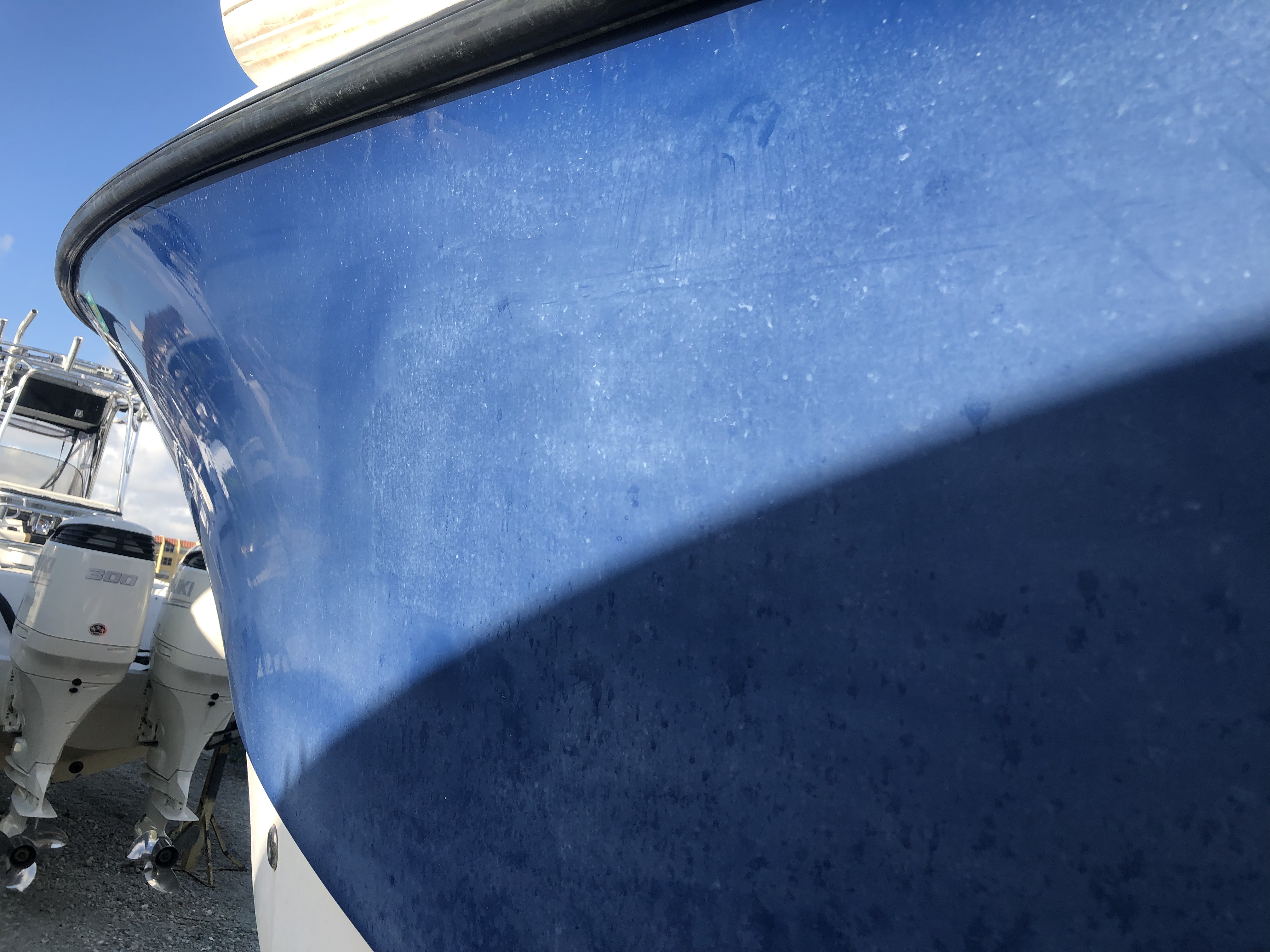 Dark blue hull with salt build up before marine ceramic coating application