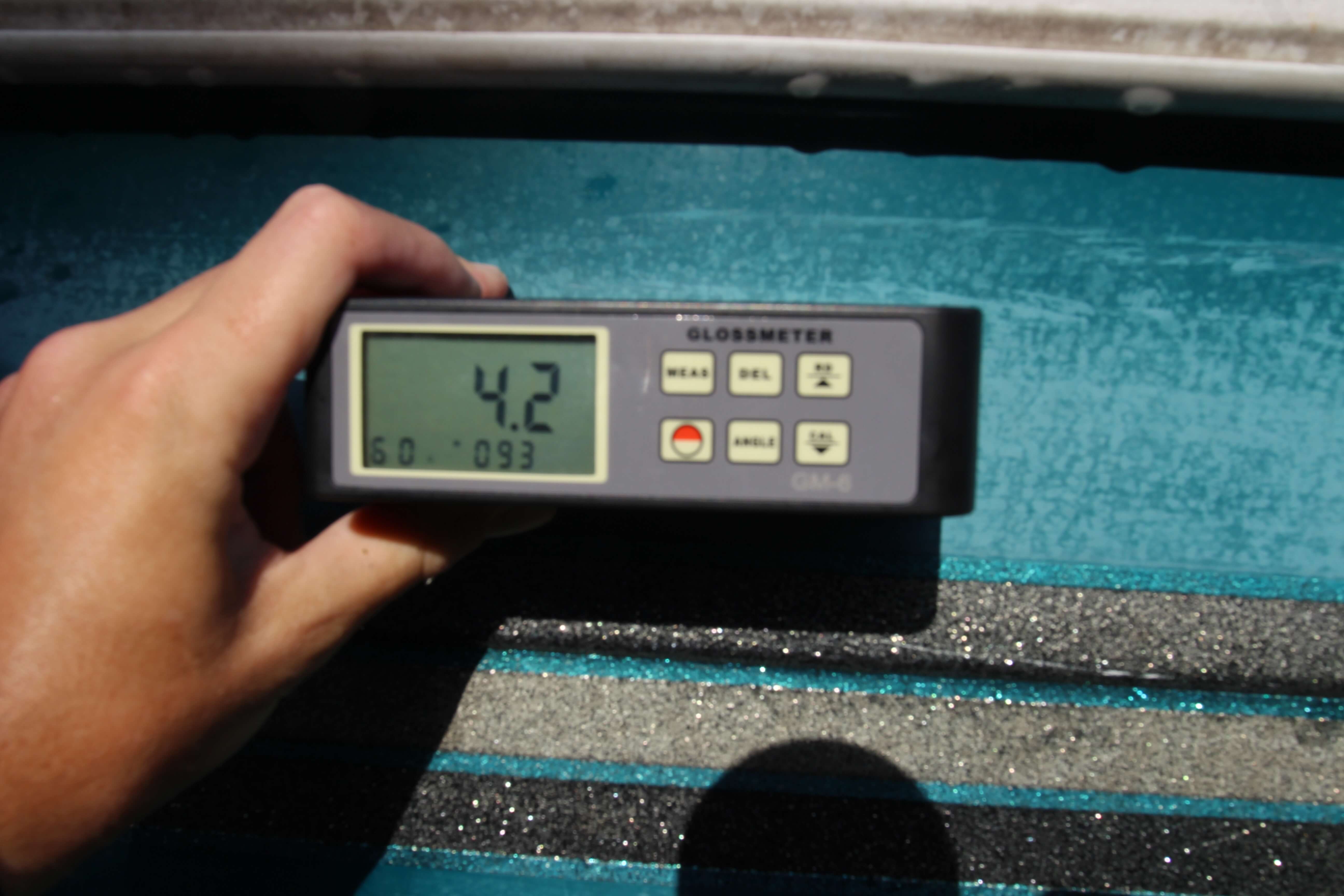 4.2 gloss meter reading on green hulled boat