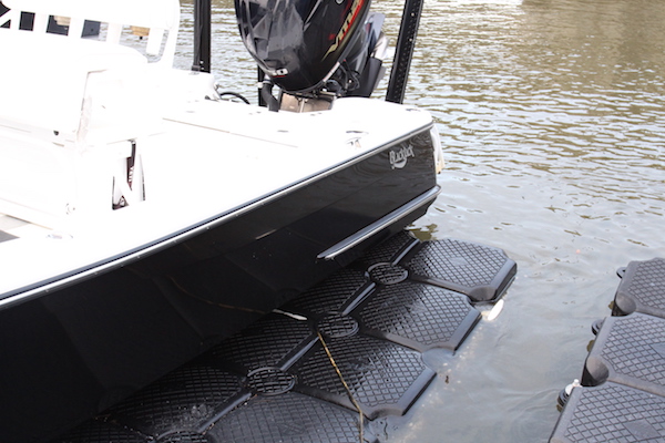 The port side of Blackjack 224 sitting on a floating dock