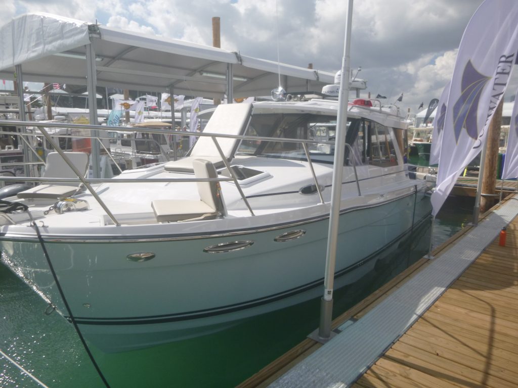 Brand new boat with ceramic coating docked at the Miami Boat Show