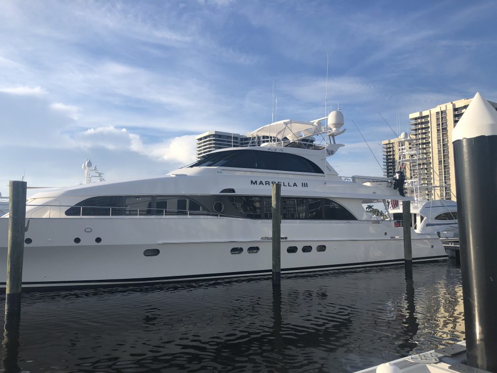 Port Side of 95' Heisley docked in the marina with ceramic coating for yachts