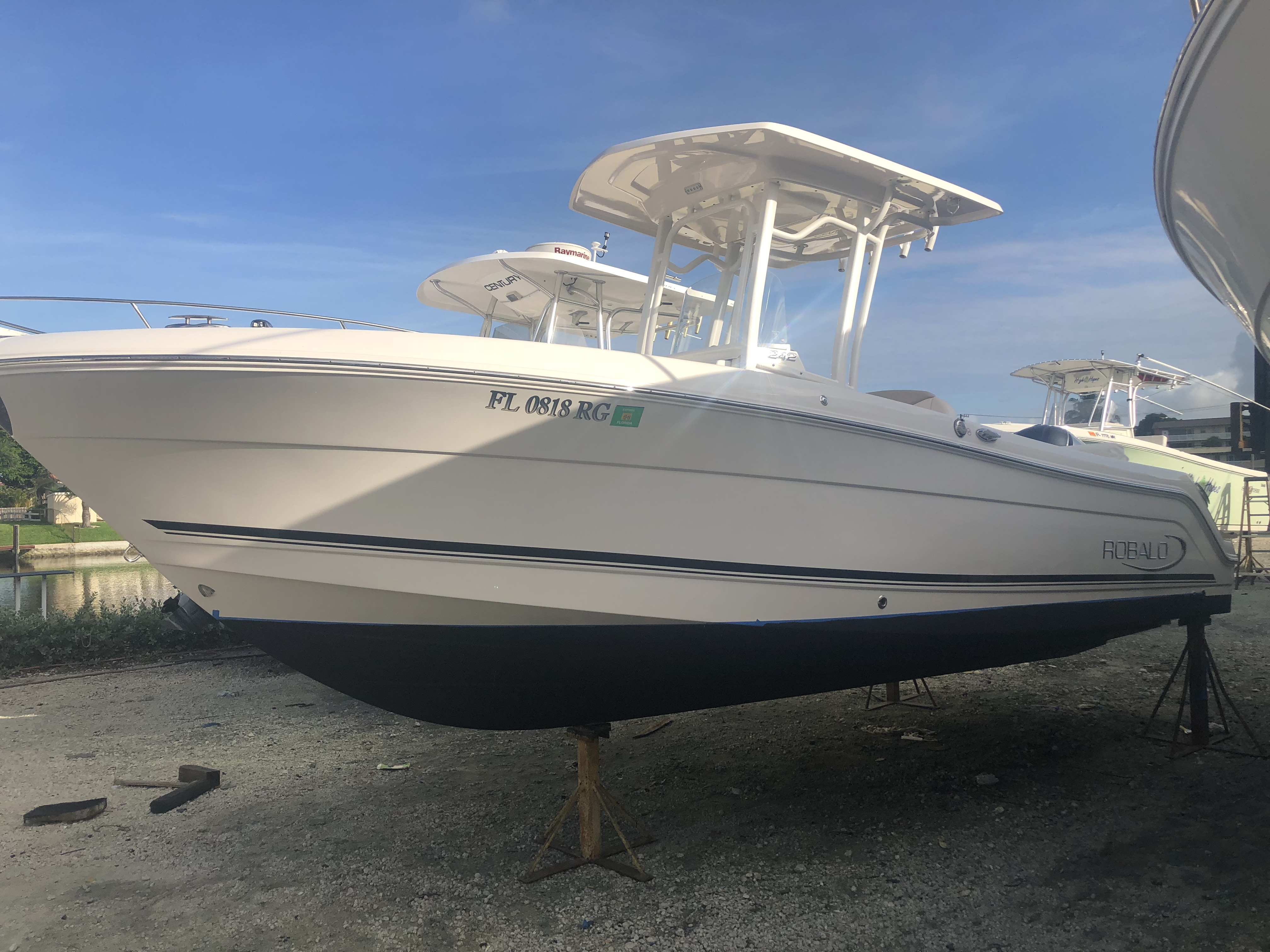 Port side of Robalo boat sitting in the yard