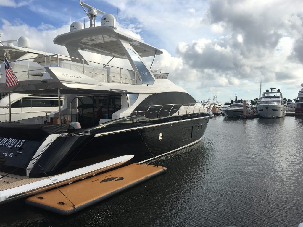 Starboard of 66' Azimut in the water after yacht ceramic coating protection application