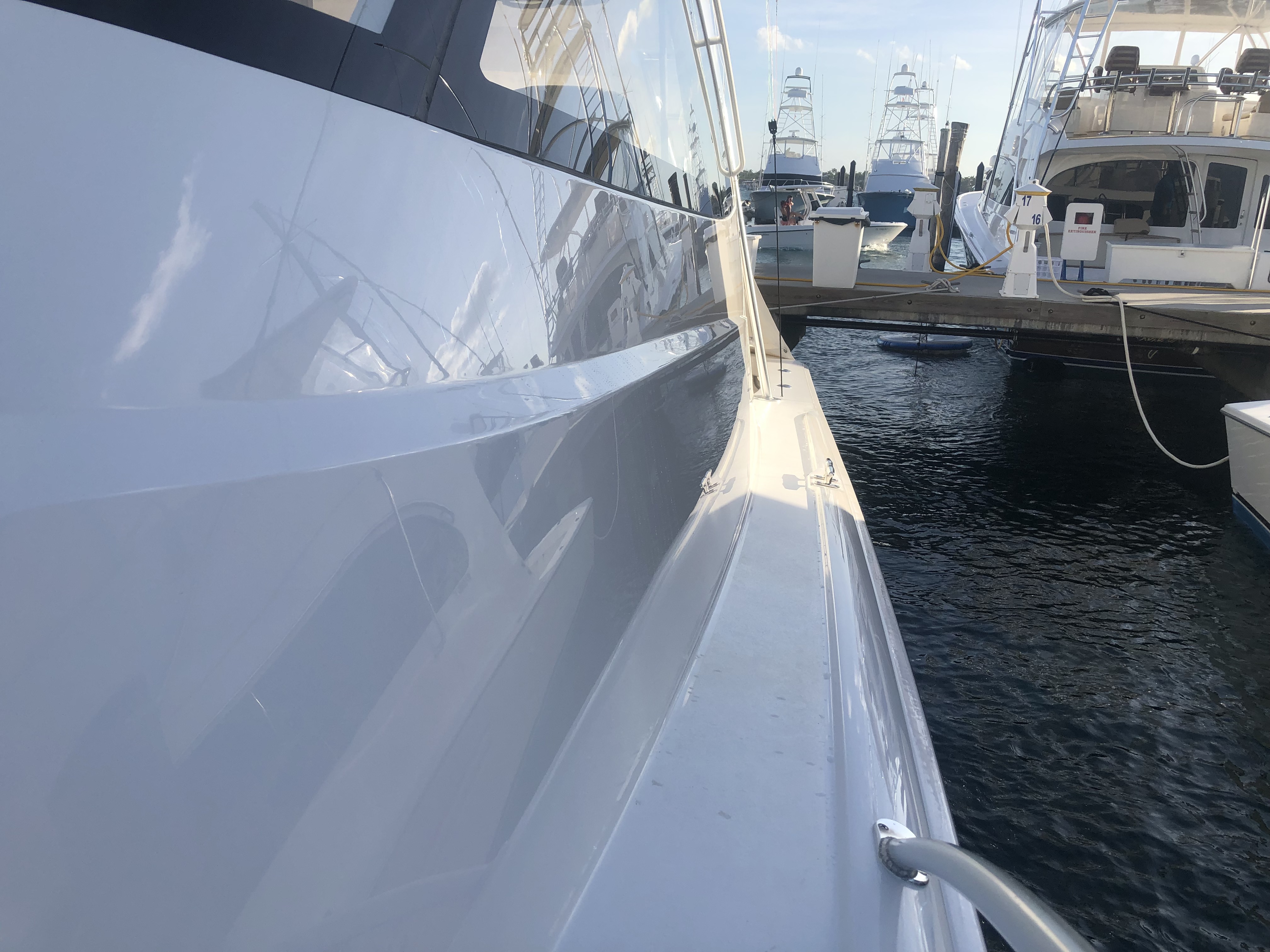 Port side of 52' Viking docked at marina after Glidecoat yacht ceramic coating protection application