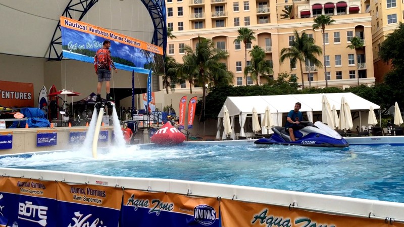 Two men in giant AquaZone at the Palm Beach International Boat Show