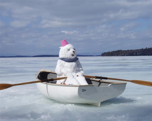 Snowman in a row boat