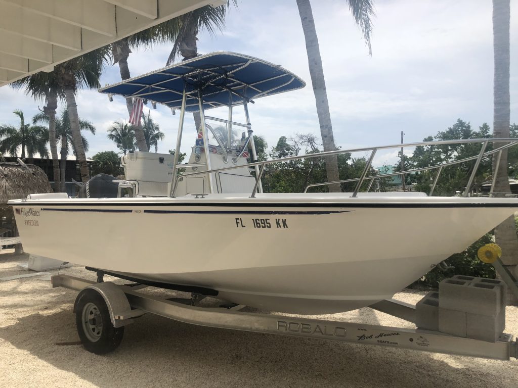 Starboard side of EdgeWater boat sitting on a trailer after Glidecoat marine ceramic coating application