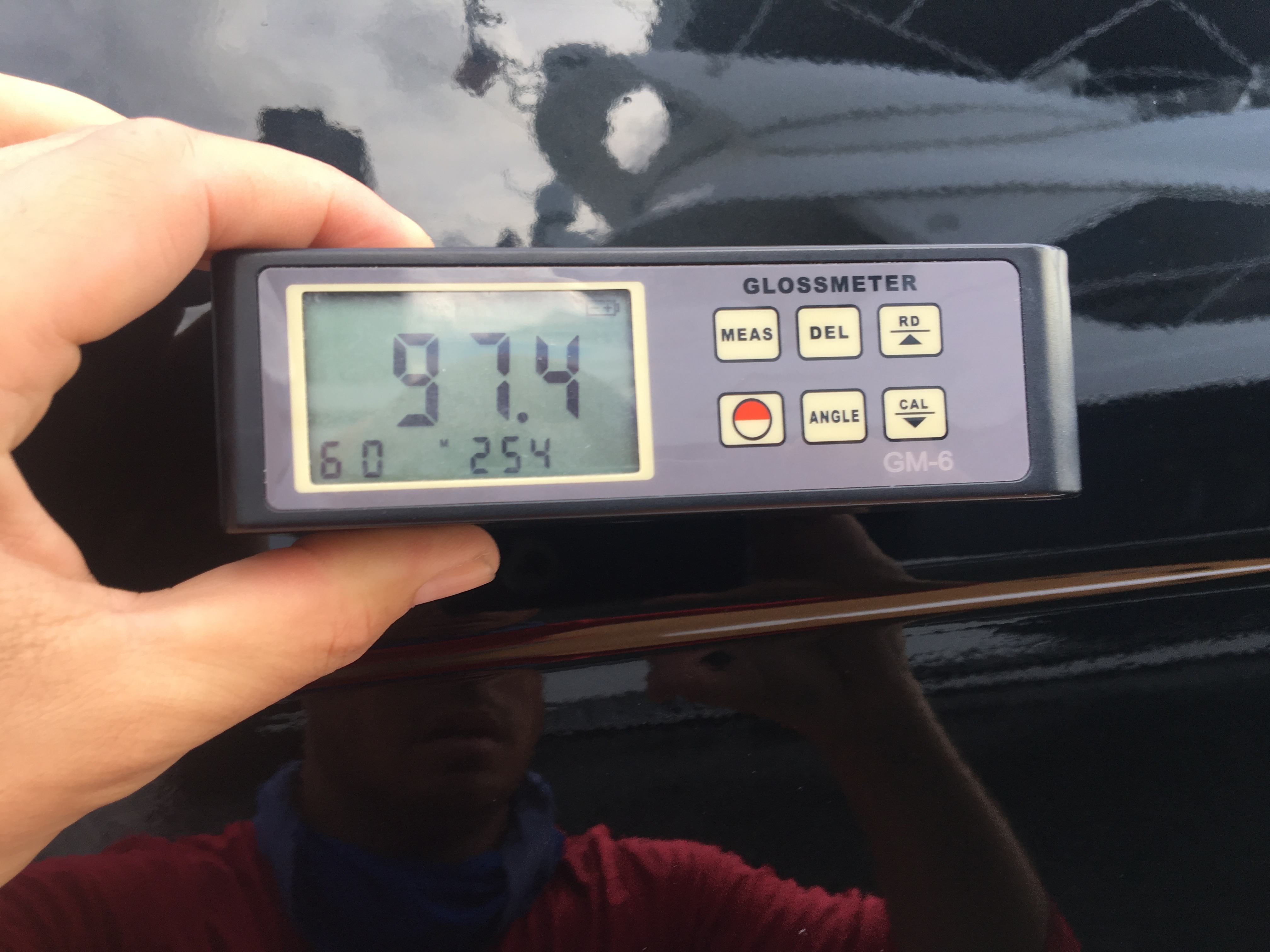 97.4 gloss meter reading on black hull of 66' Azimut