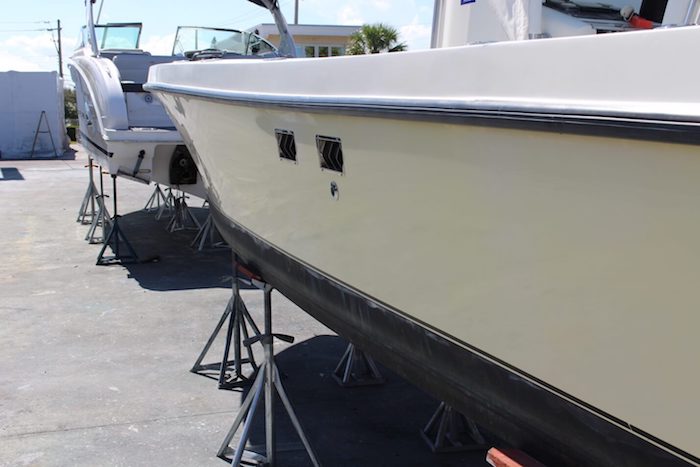 Yellow hull 29 foot SeaVee with restored original shine and color after Glidecoat ceramic coating application